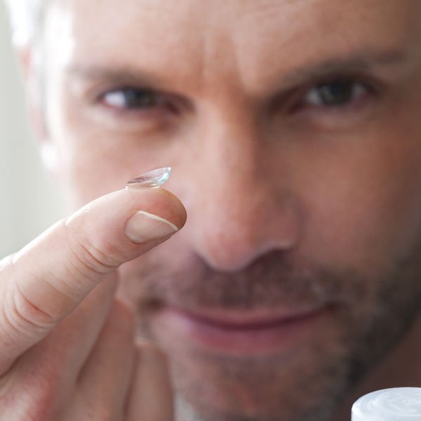 Person Holding Contact Lens