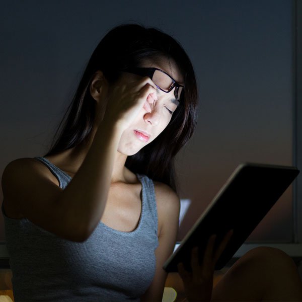 Person using screen in dark room
